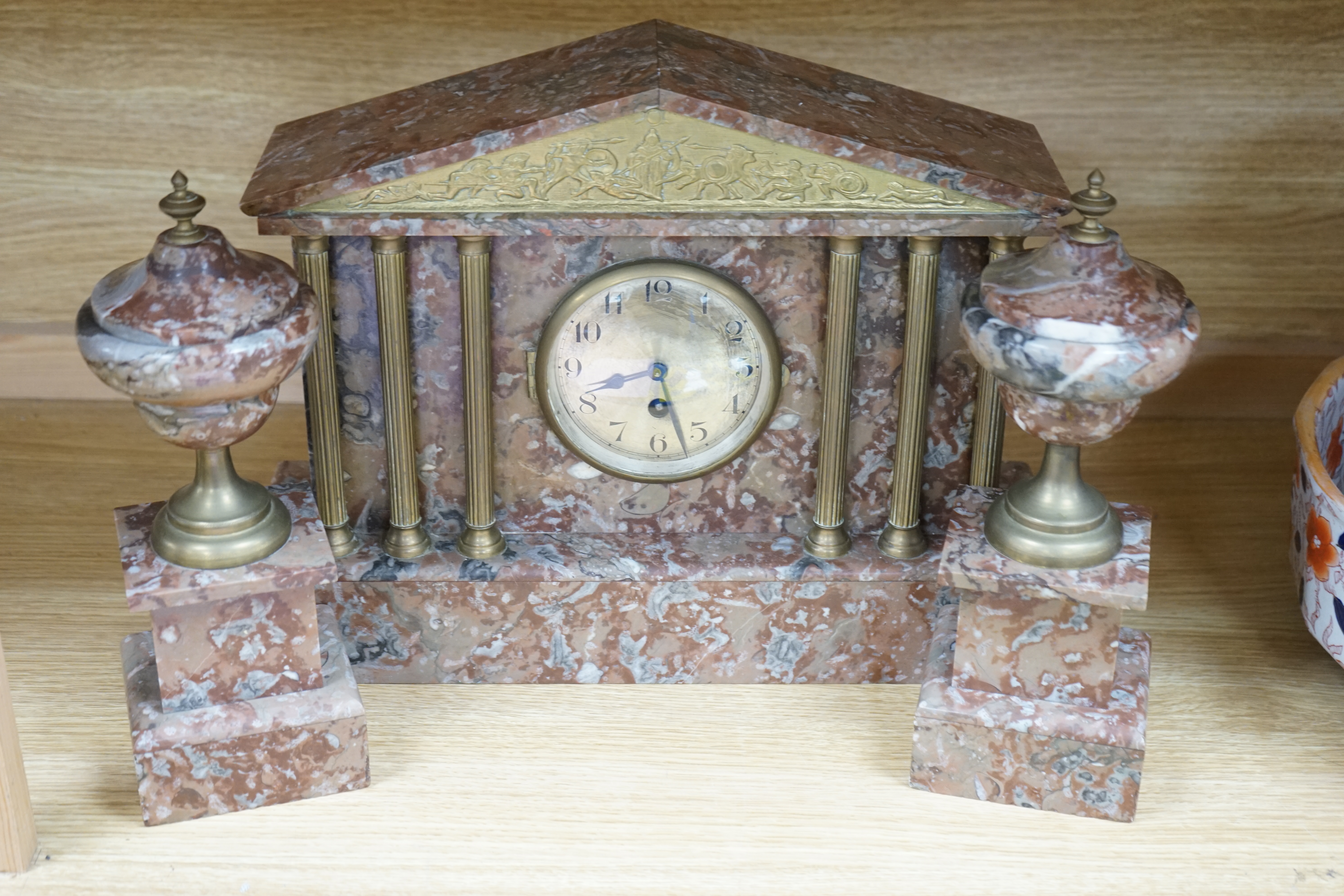 A Victorian rouge marble clock garniture, 30.5cm high. Condition - fair to good